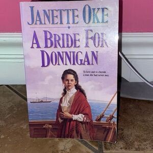 Soft cover book by Janette Oke “A Bride for Donnigan”